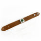 Brown leather cremation bracelet with floating ashes visible within swirls of green and brown artisan glass