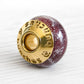 14k gold end caps with custom engraving on a deep red hand blown glass memorial bead