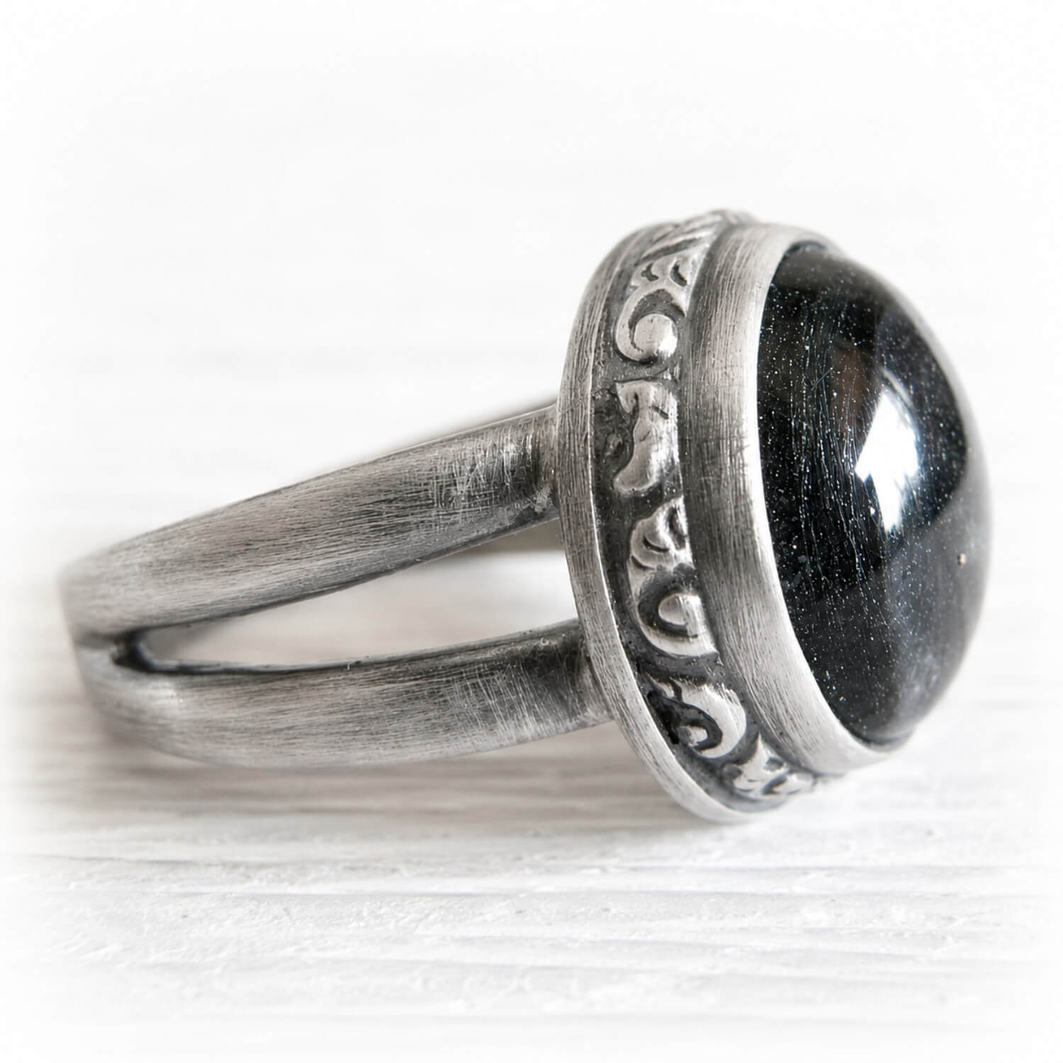 Sterling silver memorial ring with an antique finish featuring hand blown glass infused with pet ashes