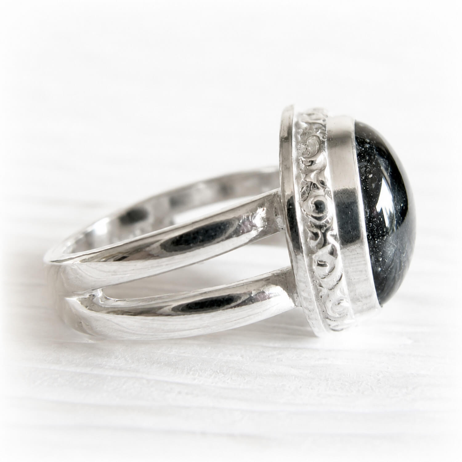 Pet ashes permanently encased in hand blown glass set in a polished sterling silver ring