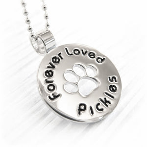 Sterling silver necklace with paw print pendant and 'Forever Loved Pickles' engraving on a white background