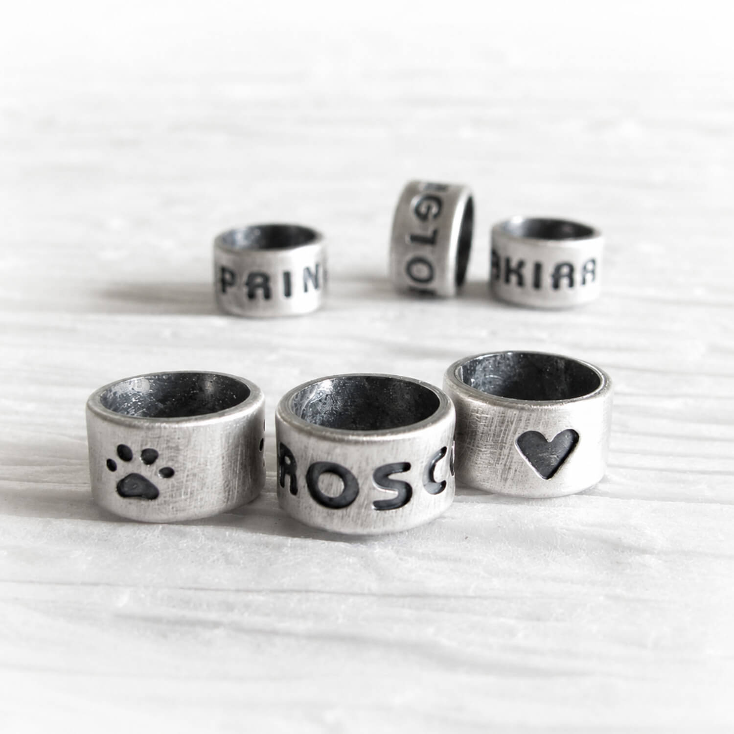 Set of sterling silver slider beads with custom engraving and an antique finish