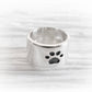 Hand forged polished sterling silver slider bead with an engraved paw print