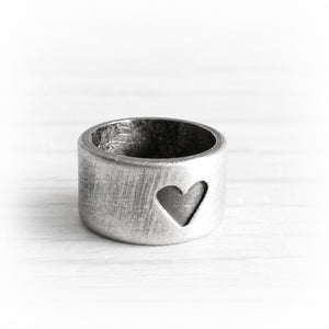 Hand crafted sterling silver slider bead with an engraved heart and an antique finish
