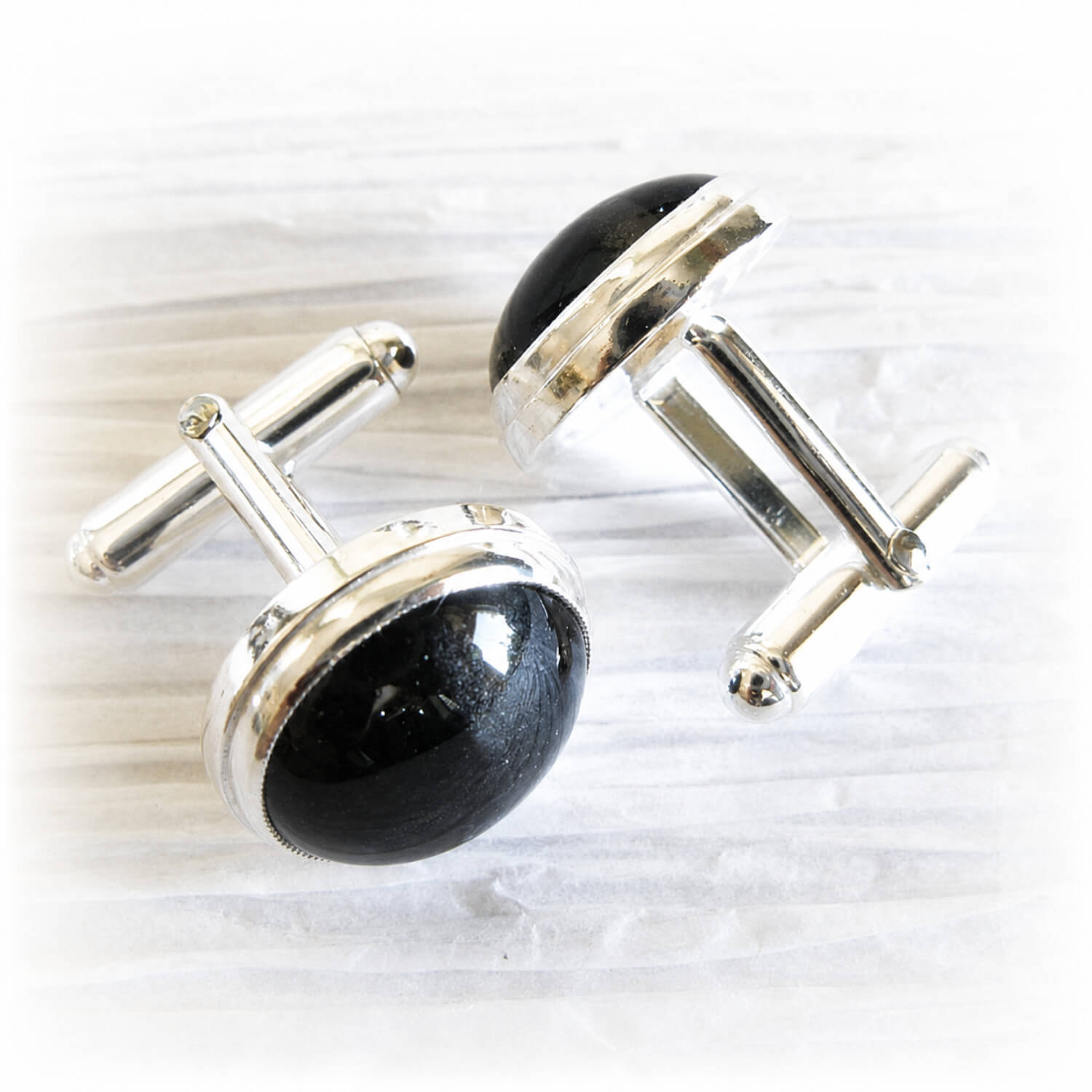 Handmade cufflinks with cremation ashes encased in hand blown glass set in sterling silver