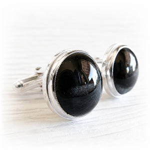 Pair of sterling silver cremation cufflinks with black hand blown glass with ashes inside the glass