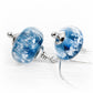 Blue glass cremation ash dangle earrings with silver bead caps on elegant drop hooks