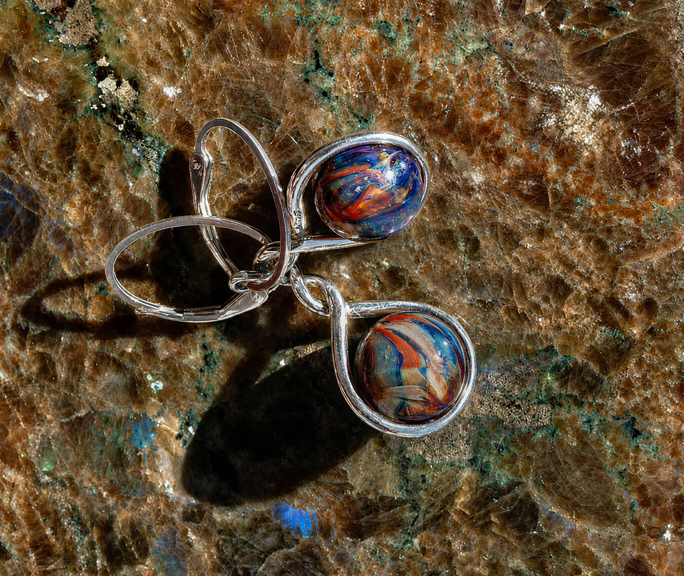Pair of sterling silver memorial earrings with hand blown glass marbles infused with cremation ashes 