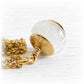 White glass cremation bead necklace featuring white ash flakes set in a 14k gold cap with a wire-wrapped bail