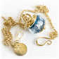 14k gold memorial jewelry featuring a blue charm bead pendant handcrafted with cremation ashes