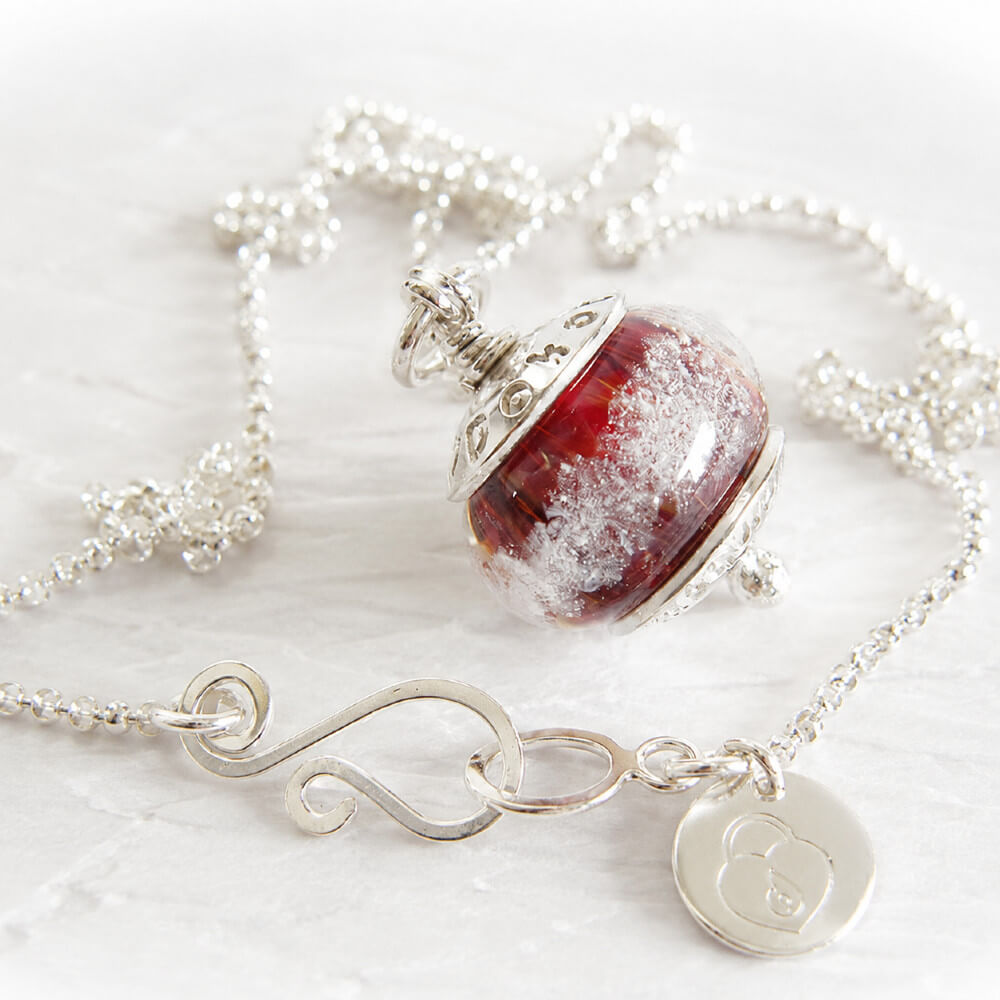 Red Artisan made glass memorial bead pendant on a sterling silver necklace