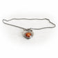 Handcrafted sterling silver keepsake necklace incorporating ashes permanently encased in a glass cabochon