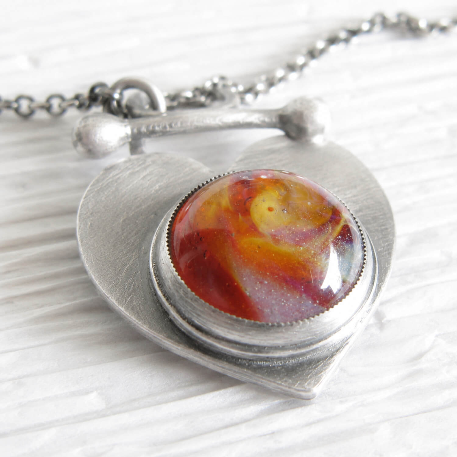 Handcrafted antiqued sterling silver keepsake lariat necklace with cremation ashes sealed within the glass