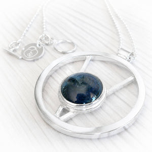 Sterling silver memorial necklace forged by hand from sterling silver with blue hand blown glass encasing cremation ashes