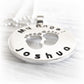Remembrance pendant with 'Joshua' engraved below two foot prints made from sterling silver