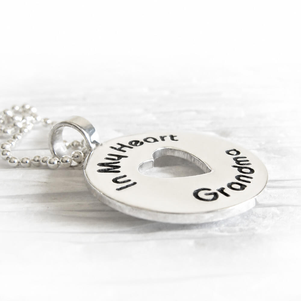 Sterling silver memorial necklace with pendant reading 'In My Heart Grandma' with a heart cutout