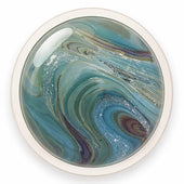 Round decorative item with swirling blue and green pattern on a white background