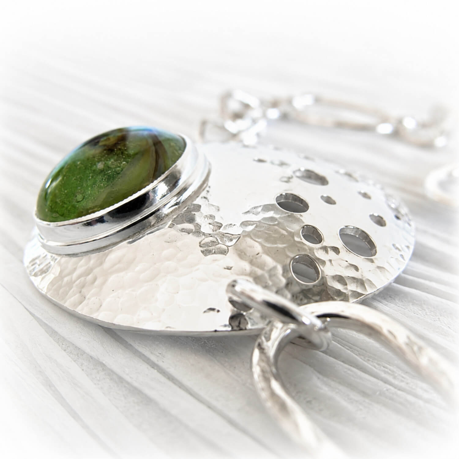 Sterling silver cremation bracelet together with a handmade green glass cabochon with encased ashes of a pet