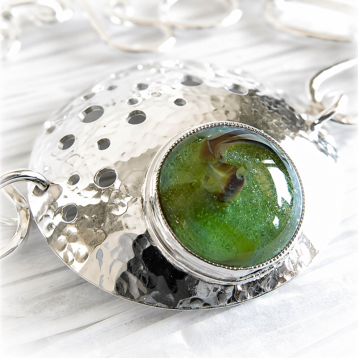Artisan crafted glass memorial stone set in a hand forged sterling silver bracelet
