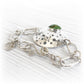Hand forged commemorative bracelet displaying a green hand blown glass center piece infused with ashes