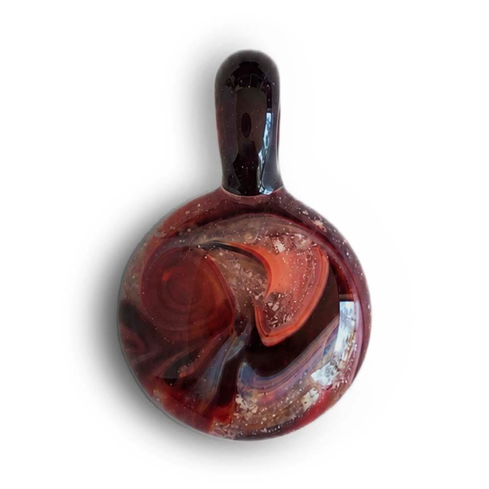 Dark red swirls of glass combined with cremation ashes artisan crafted into a memorial pendant