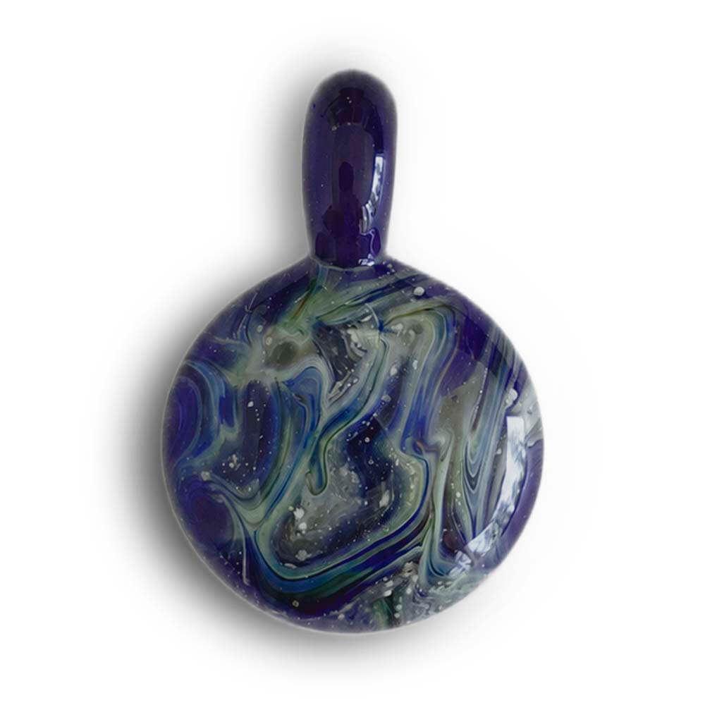 Glass memorial pendant made with swirls of lapis lazuli colored glass and cremation ashes