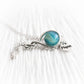 Memorial necklace with an aqua colored cremation glass marble and a tiny personalized heart charm