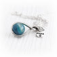 Handmade glass cremation marble set in a sterling silver memorial necklace with a custom engraved silver tag