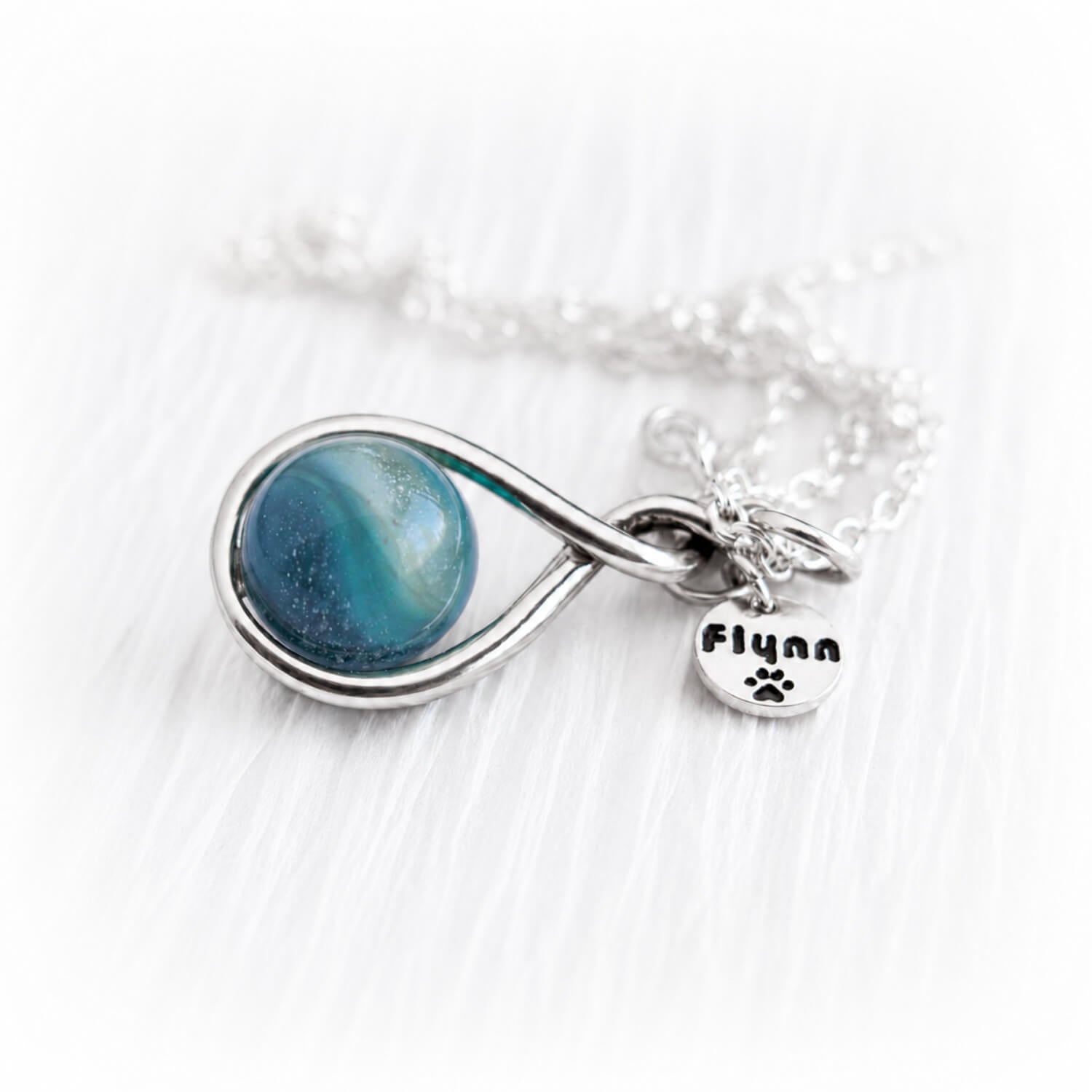 Handmade glass cremation marble set in a sterling silver memorial necklace with a custom engraved silver tag