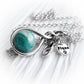 Sterling silver memorial necklace with a teal and aqua cremation marble and a custom engraved silver tag